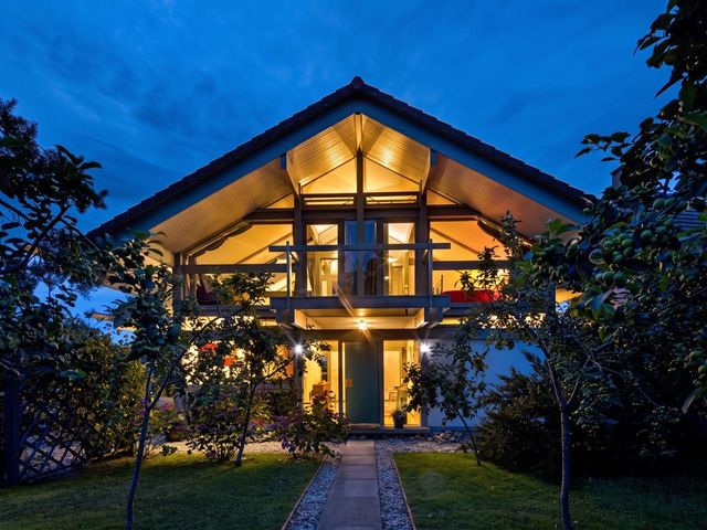 A house with illuminated windows at Two Hoots Littleworth