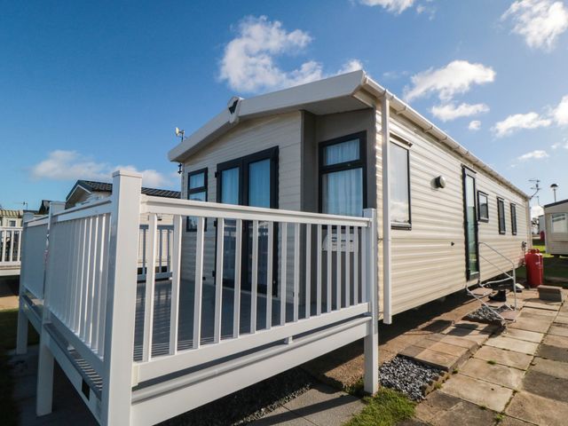 A caravan with a deck area at Gosling 14 in Scarborough