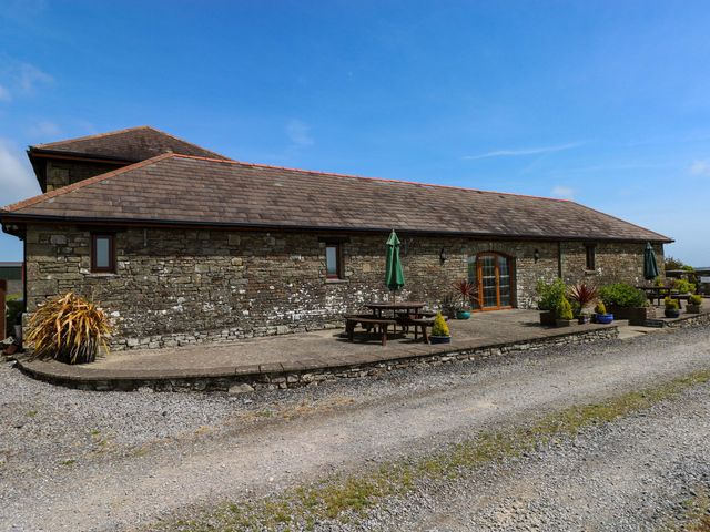 A patio area with furniture at The Dairy in Penuel near Llanmorlais