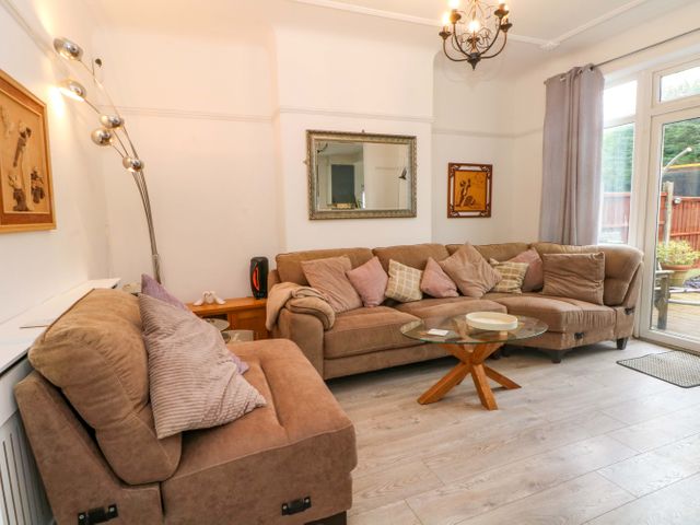 A living room with a sofa and coffee table at Thomas Lane Liverpool