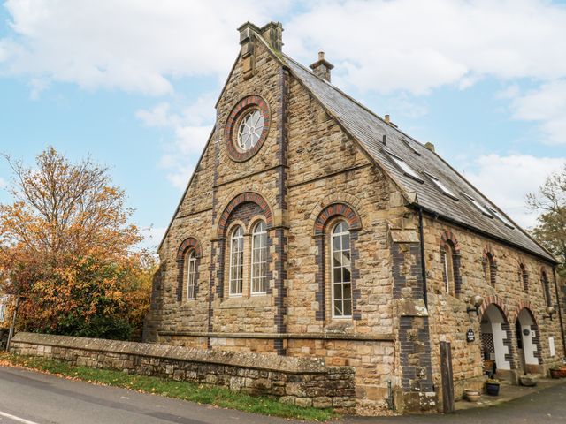 A stone building with windows and a door at 1 The Old Methodist Chapel in Rosedale Abbey