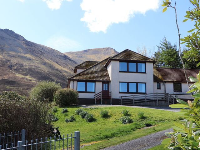 A house in front of mountains at MacKenzie’s Peak Sconser near Portree