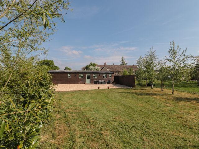 An outdoor view of a building with garden space at Garden Cottage, Rode Farm in Rode