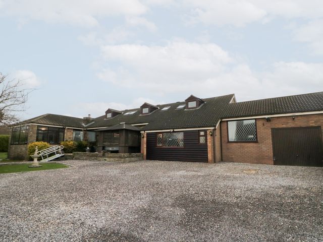 A house with a garage and driveway at Seacrest Lodge in Scarborough
