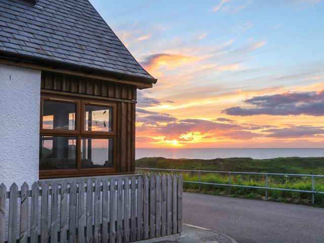 A house with a fence and ocean view at Seascape in Portknockie