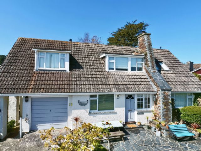A house with windows and a chimney at Kilcarreg in Rock near Wadebridge