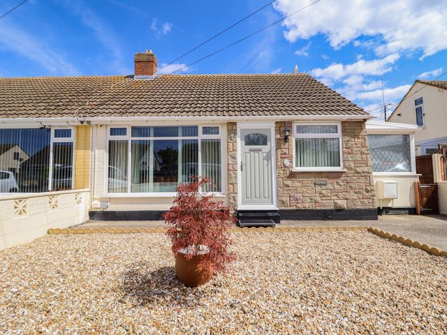 A house exterior with a door and windows at Chy Bean Abergele