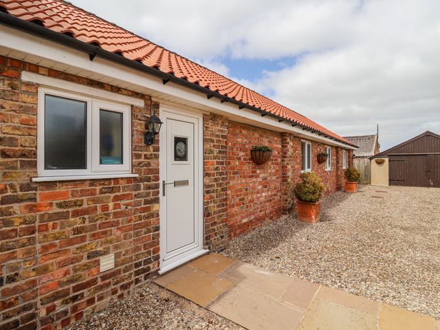 An entrance with a door and windows at The Wagon Shed in Gransmoor near Bridlington