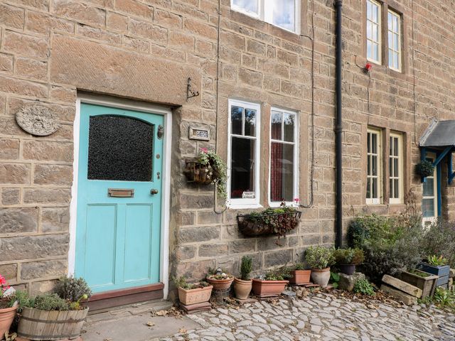 A front door with windows and plant pots at 40 Water Lane Matlock