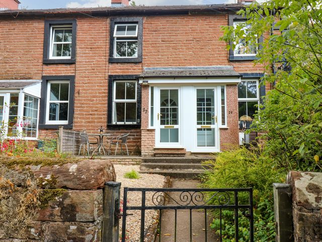 A house with a front garden and gate at 27 Bongate in Appleby-In-Westmorland