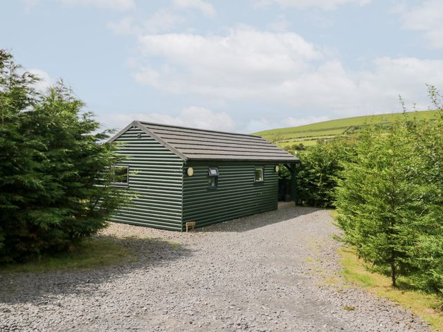 A cabin surrounded by trees at Ash Lodge Pennington near Ulverston
