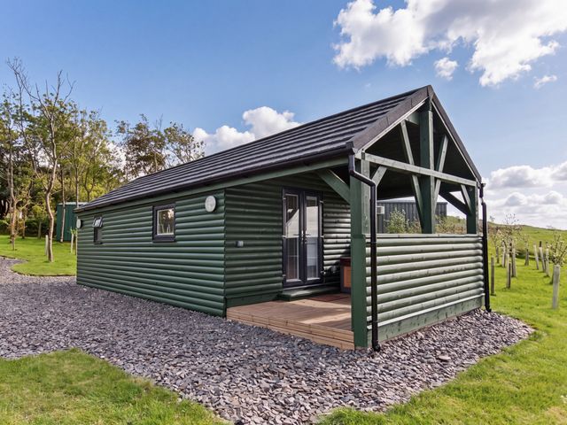A house exterior with a deck at Ash Lodge in Pennington near Ulverston