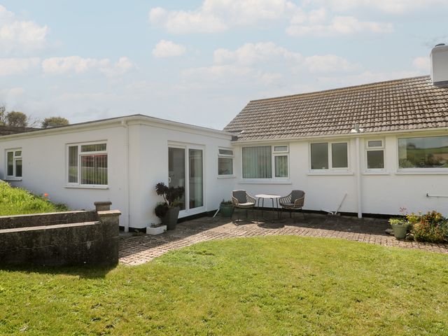 An outdoor area with a table and chairs at Bre An Mor in Praa Sands