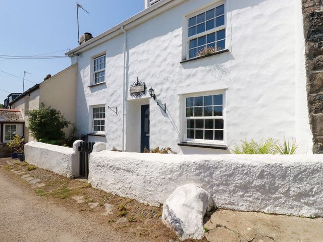 A house with windows and a door at Penrose Farm Cottage St Keverne