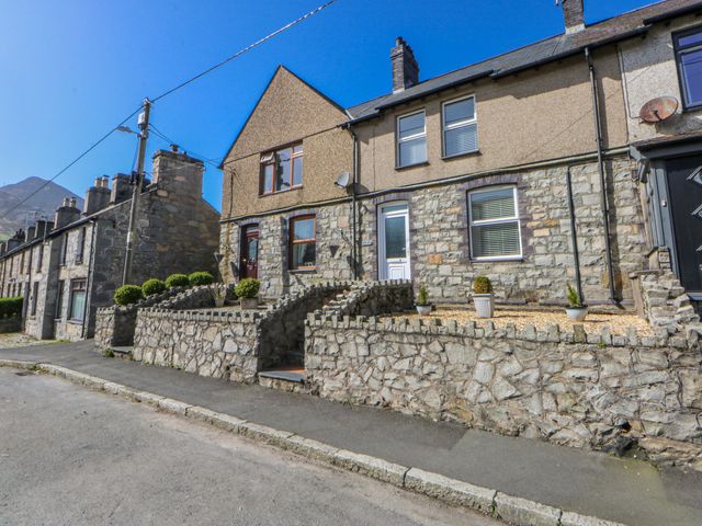 A house with stone walls and steps at Bythynnod Newydd Trefor near Nefyn