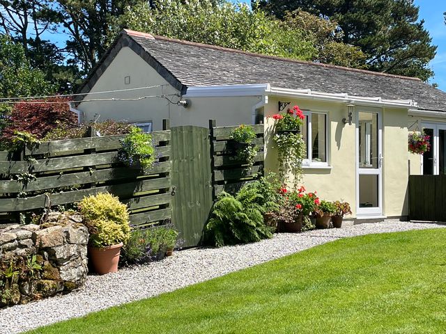 A house with a garden and fence at Garden Cottage in St Just