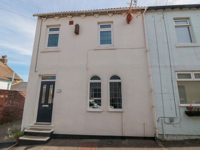 A house exterior with windows and front door at Sands End Cottage in Marske-by-the-Sea