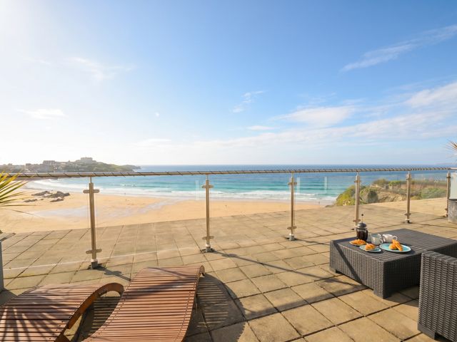 An outdoor balcony with ocean view and furniture at The View in Newquay