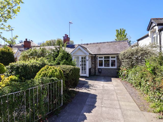 A front view of a house with garden at Ty Cerrig Dyserth