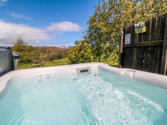 A hot tub with greenery in the background at Carters in Staintondale near Burniston