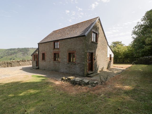 A house with a garden and pathway at Penrhiwarwydd Barn Pontywaun