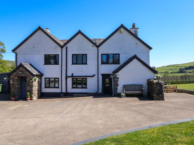 A house with a driveway and lawn at Cefn Nannau near Ty-nant Cerrigydrudion