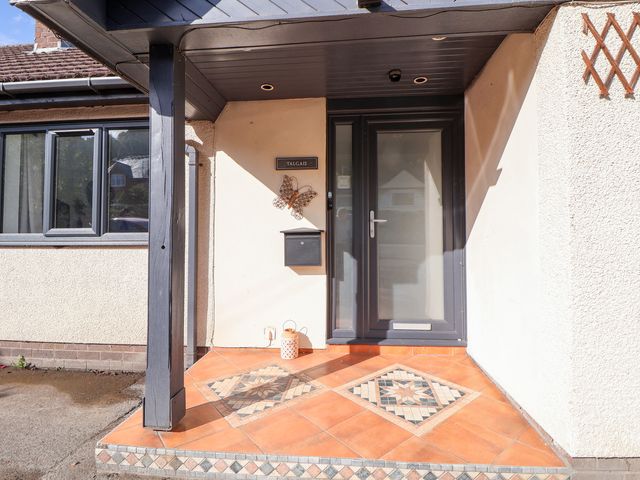 An entrance with a door and tiled flooring at Talgais in Llangollen