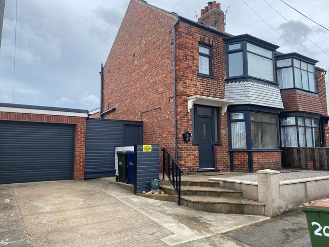 A house with a garage and driveway at 204 Sea View House Marske-by-the-Sea