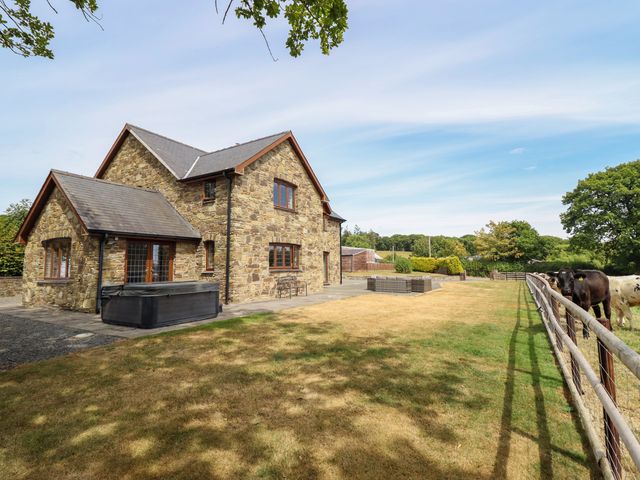 A house with a hot tub and patio in Caersws at Ty Berllan