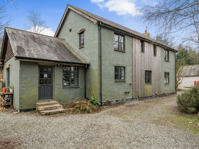 A house with a gravel driveway and front door at Spring Park Farmhouse in Launceston