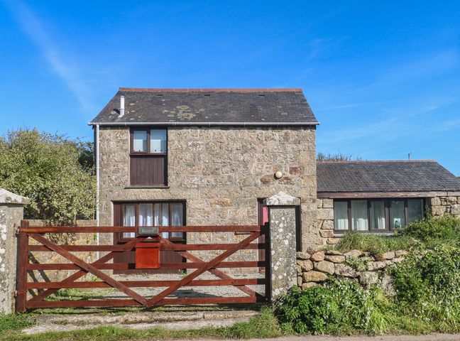 A stone house with a gate at Kernyk in Penzance