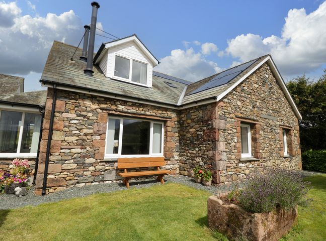 A house with stone walls and a garden at Sherriff, Troutbeck, near Keswick