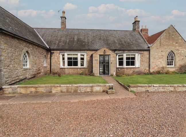 A house with garden and pathway at The Coach House Crookham near Cornhill-On-Tweed