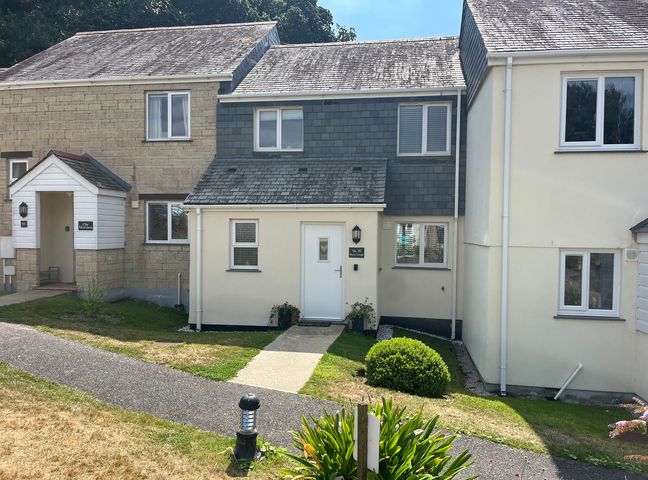 A house with a pathway and garden at Breeze Cottage in Falmouth