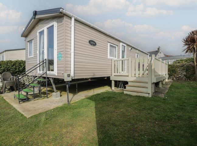 A caravan with stairs and a deck at Gold Caravan (316) Talybont