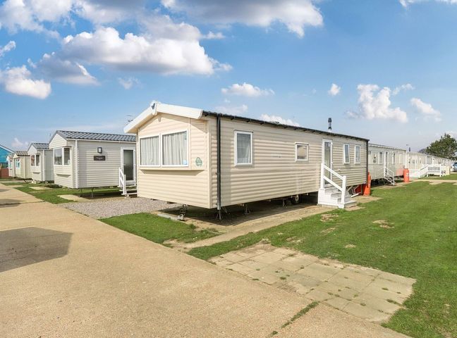 Mobile home exterior at Windsurfer’s Rest - Hayling Island Holiday Park