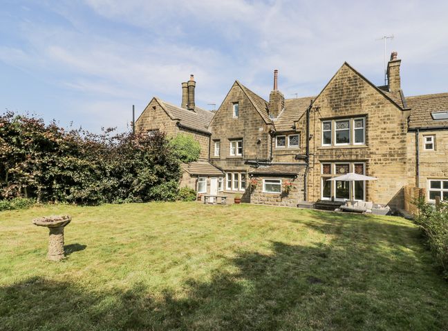 A house with a garden and patio at Cold Spring House in Cullingworth
