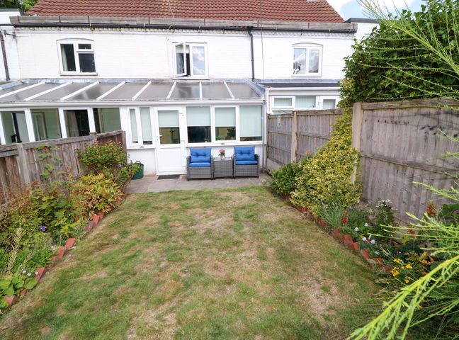 A garden with seating and plants at 37 East Lane Mansfield