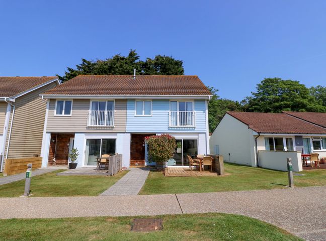 A semi detached house with two patios and outdoor furniture at Whitfield P1 in Yarmouth