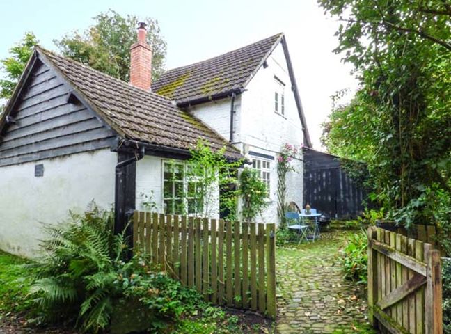 A house with a garden and furniture at The Smithy Lucton near Mortimers Cross