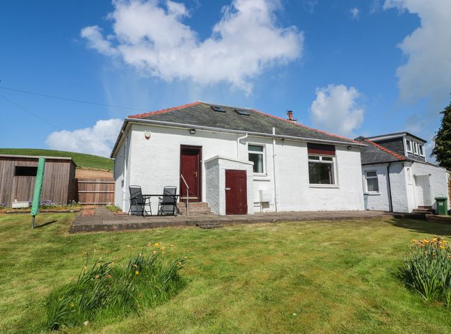 A house with a garden and patio at Sundale in Strathaven