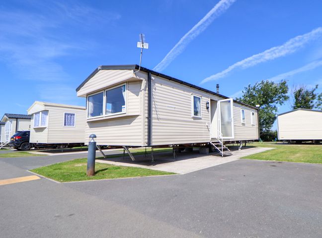 A static caravan with steps and a pathway at Willerby Aurora B14 Towyn