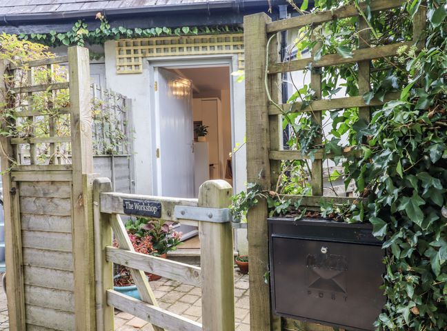 An entrance gate and door leading to The Workshop in Mary Tavy