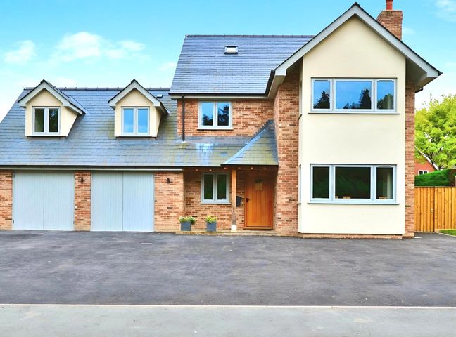 A house with garage and multiple windows at Cefn Coed in Presteigne
