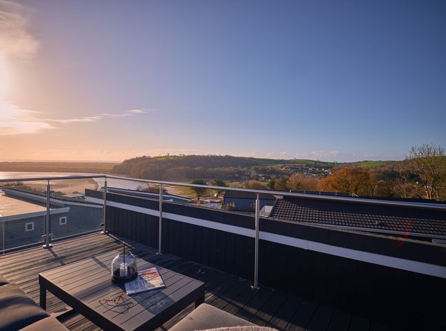 A roof terrace with a table and view at Epic Spa (Roof Terrace) (Pet) in Laugharne
