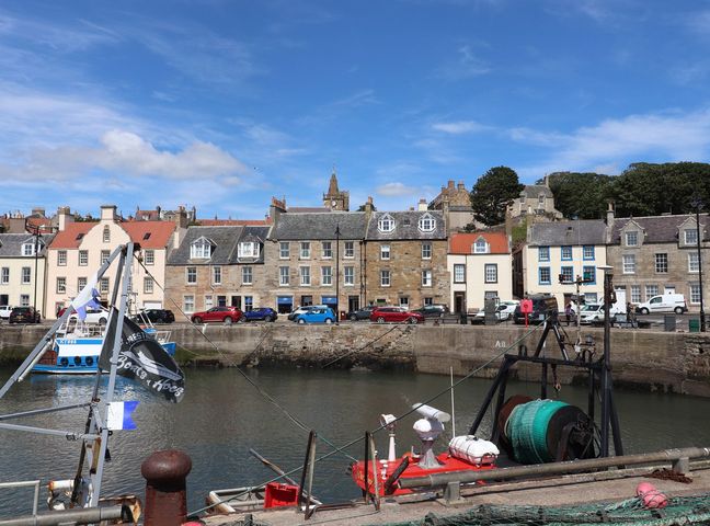 A harbor with boats and buildings at Flour Loft in Anstruther