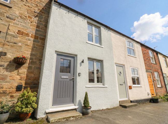 A view of the front of a house with doors and windows at Brooklyn Cottage Kirkby Malzeard