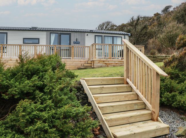An exterior view of a property with steps and decking at Willow's Way in Stranraer
