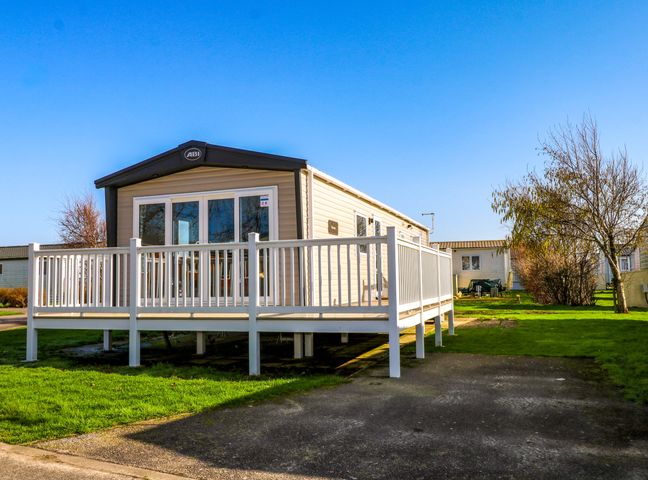 A cabin with a deck and steps at 0028 South Beach