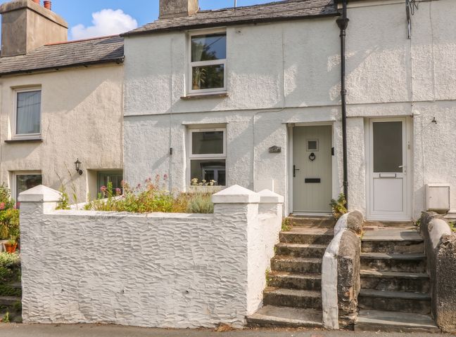 A house exterior with front door and steps at Bedford Cottage in Yelverton